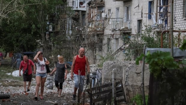 At least 15 killed after Russian rockets hit apartment building in Donetsk, local officials say